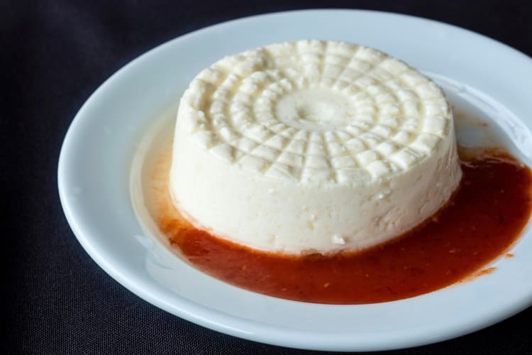 Goat cheese on a plate with sauce