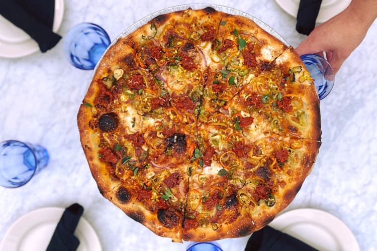 Aerial view of a pizza from Tiny Champions, a restaurant in Houston
