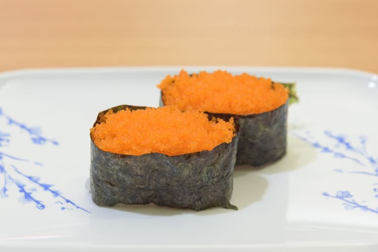 Rice wrapped in nori and topped with masago