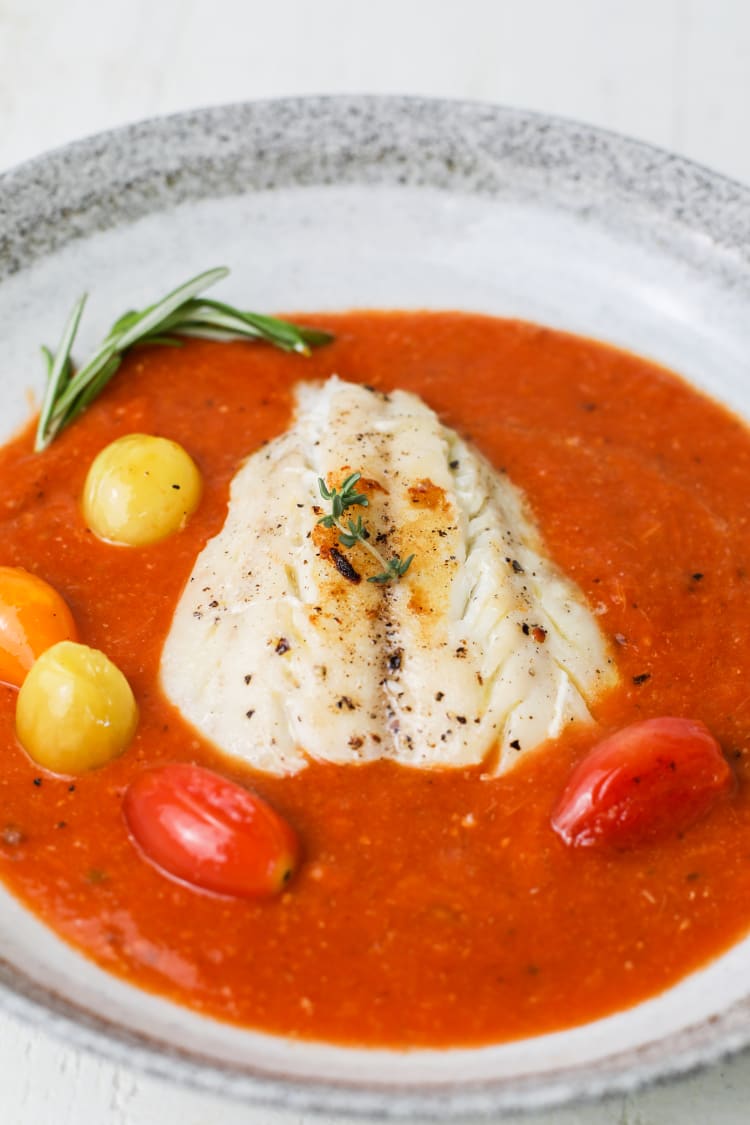 tomato sauce over white fish