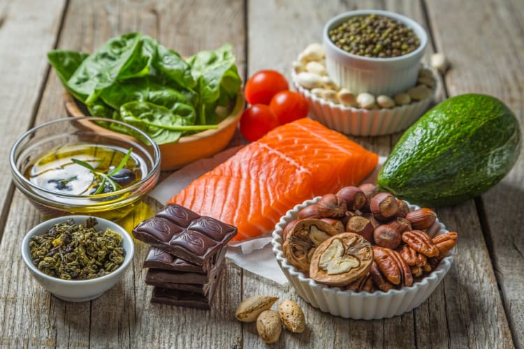 A selection of healthy ingredients like salmon, nuts and avocado