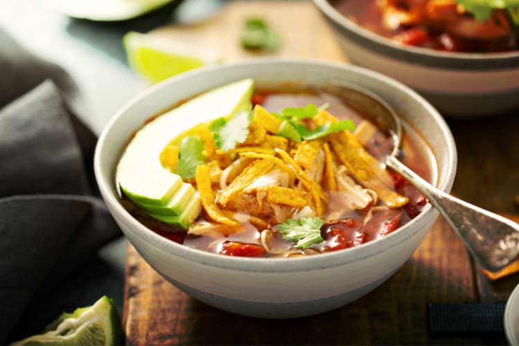 Tortilla soup with a variety of ingredients in