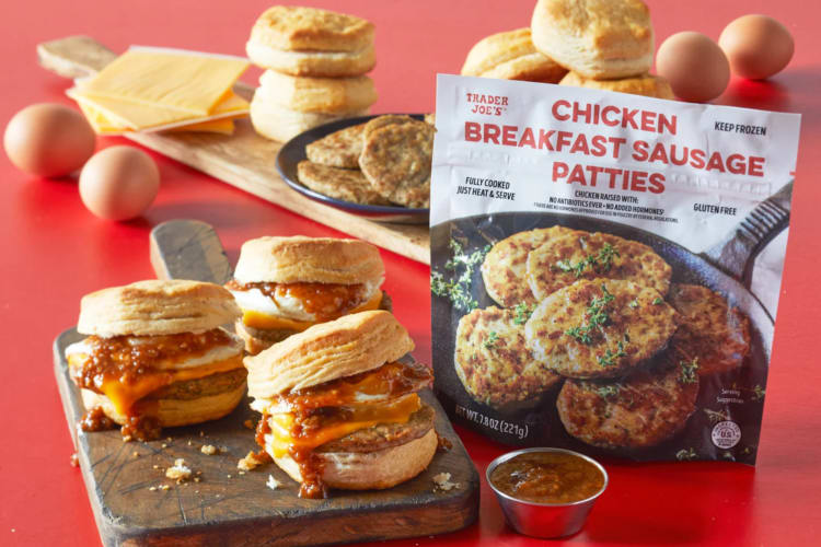 Biscuits with sausage patties next to a bag of Chicken Breakfast Sausage Patties