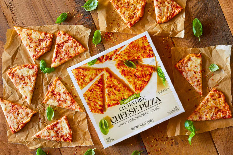 A pizza box surrounded by slices of cheese pizza