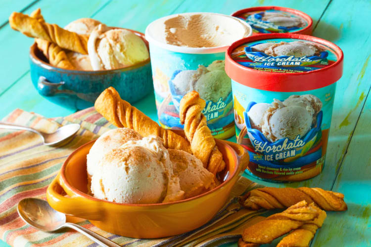 Bowls of ice cream next to tubs or horchata ice cream