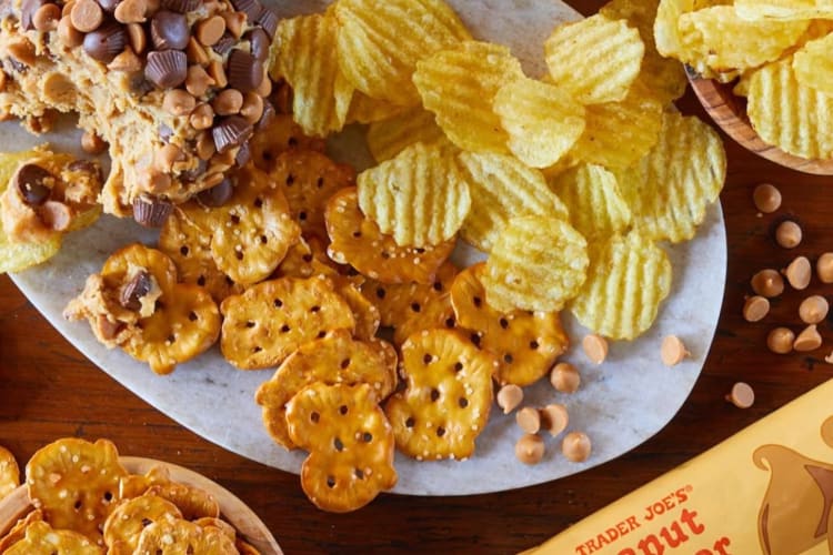 Pretzels, chips and cookie dough on a plate