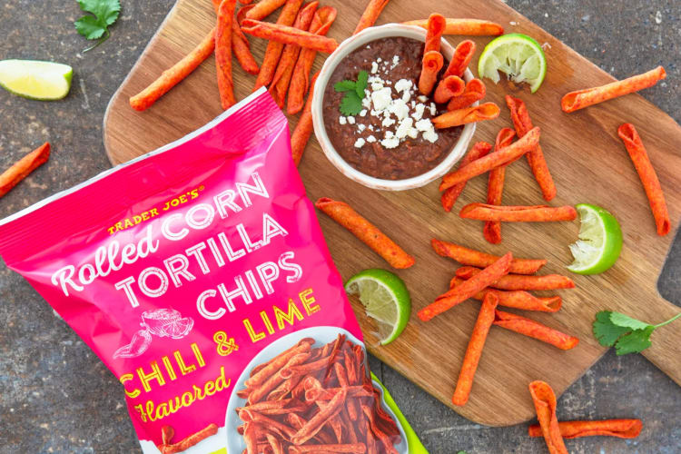 Rolled tortilla chips with black bean dip and fresh lime