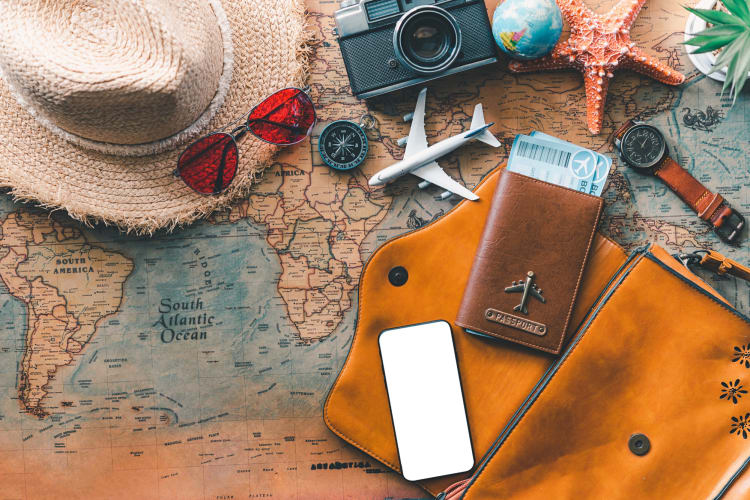 Travel accessories on top of world map