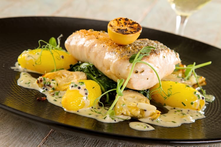 Fish cod loin on a bed of vegetables