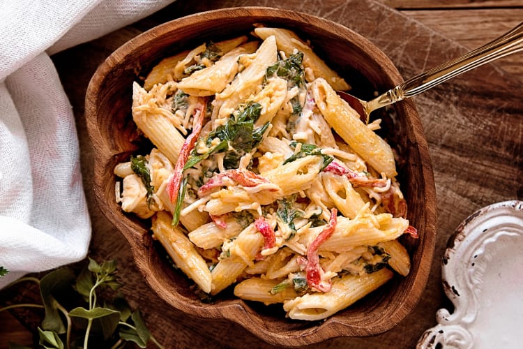 Aerial shot of pasta in a brown wooden bowl