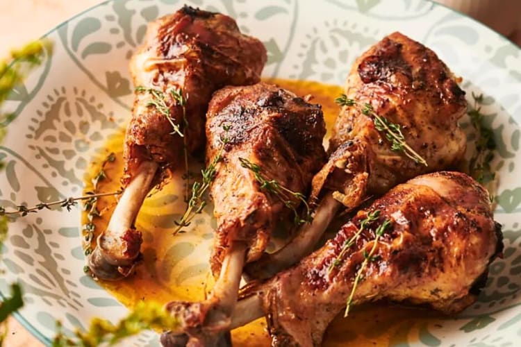 Four turkey legs in a bowl