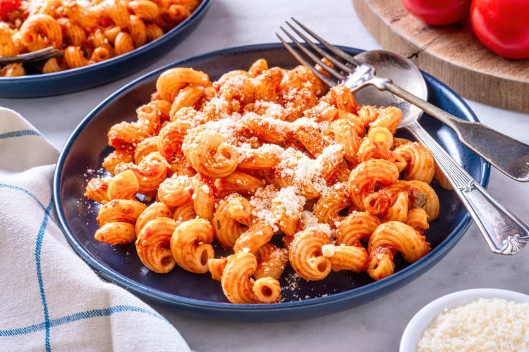 A bowl of spiral pasta with tomato sauce