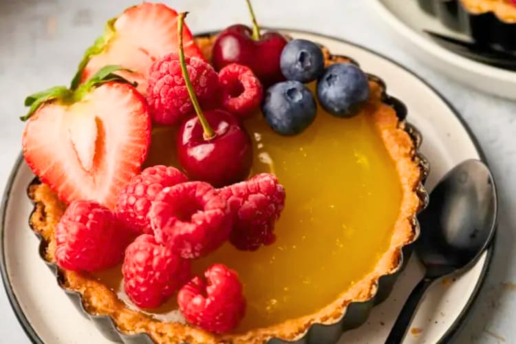 A lemon tart with fresh berries