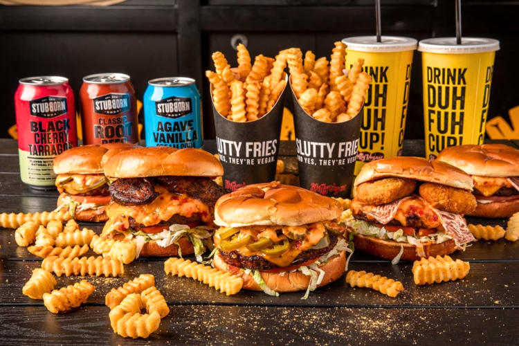 Burgers, fries and drinks on a table