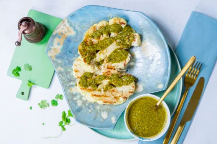Vegan cauliflower steaks with a herbaceous chermoula sauce
