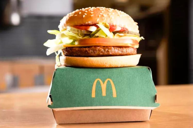 A veggie burger on a green McDonald's box