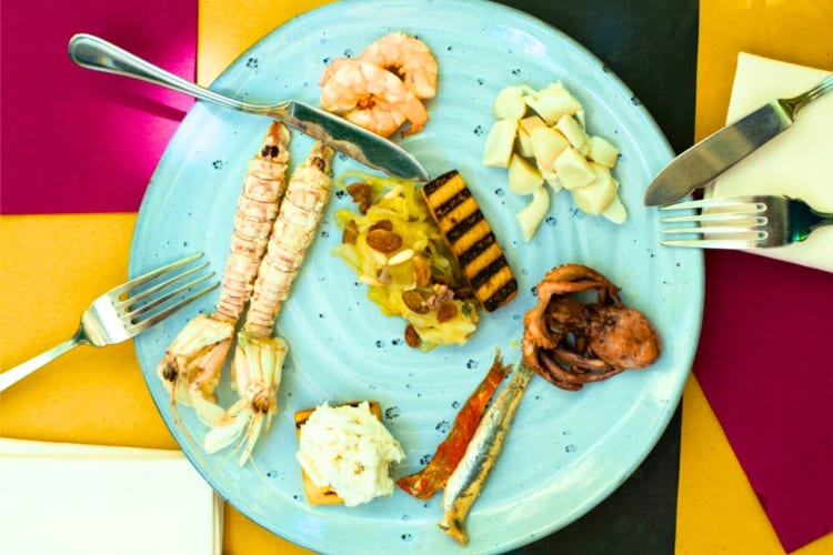 A selection of seafood on a blue plate