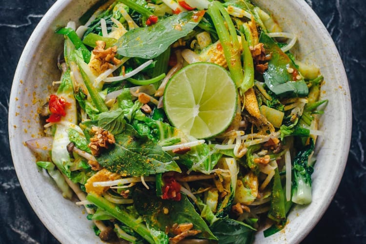 a fresh vietnamese broth with vermicelli noodles and salad