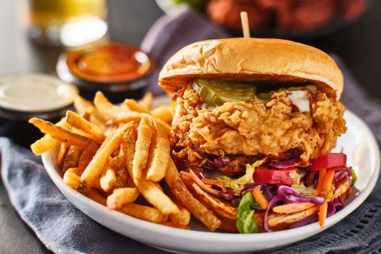 Chicken sandwich with fries on the side