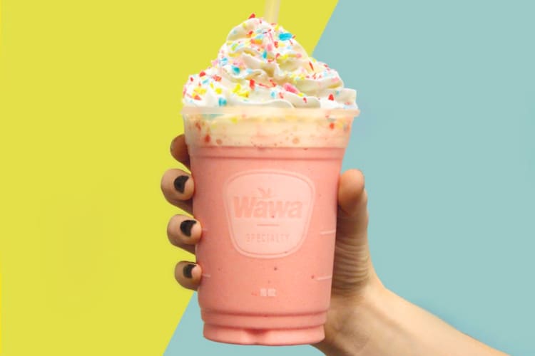 Strawberry milkshake served with whipped cream