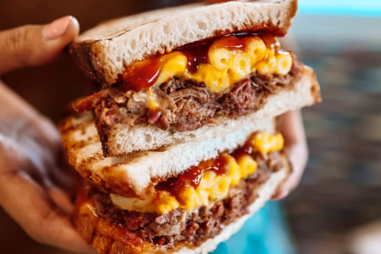 A Wawa secret menu sourdough sandwich with pulled pork and mac and cheese