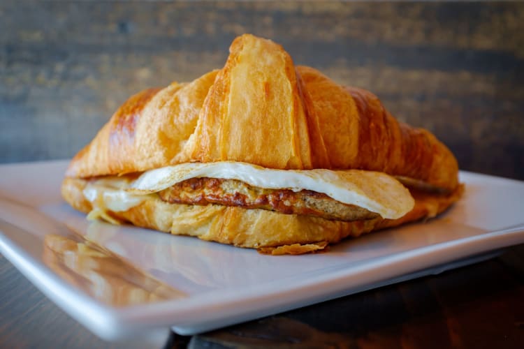 A sausage-and-egg-filled croissant.