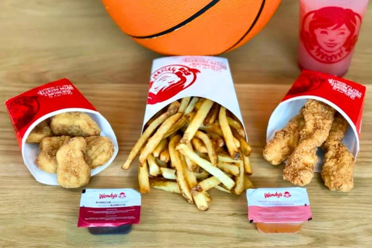 Wendy's fast food fries and nuggest next to a basketball