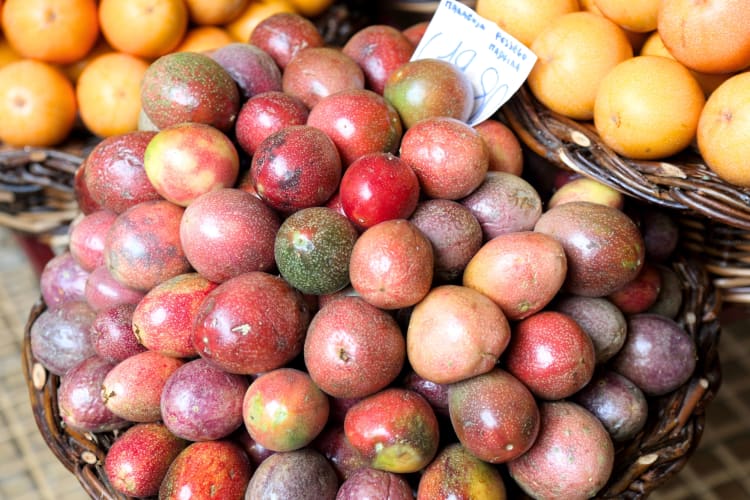 Passion fruits in a basket for sale at a market