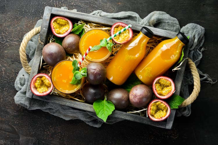 A tray with passion fruit and passion fruit juice