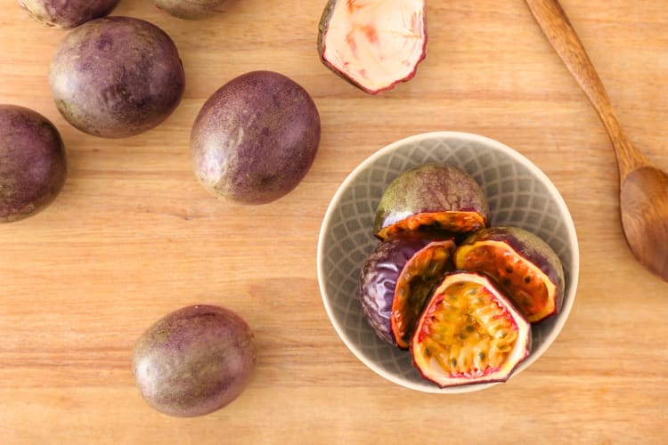 Passion fruit on a wooden counter