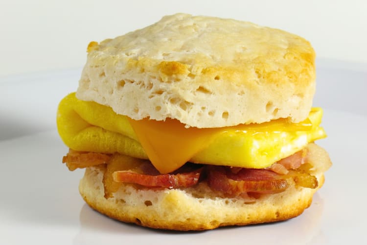 Eye-level view of a bacon, egg and cheese biscuit