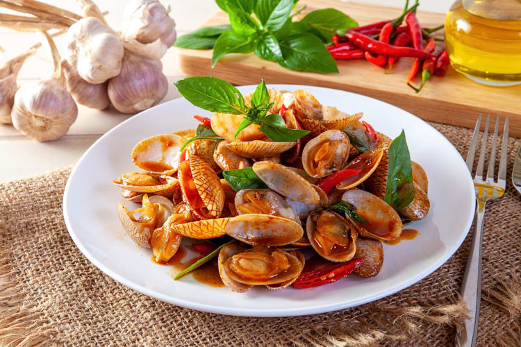Fried clams chili on a white plate