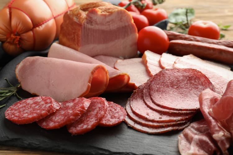A selection of deli meats, including ham.
