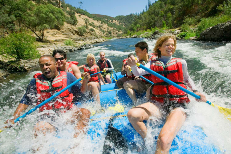 Different couples on a boat white water rafting during a date idea in OKC