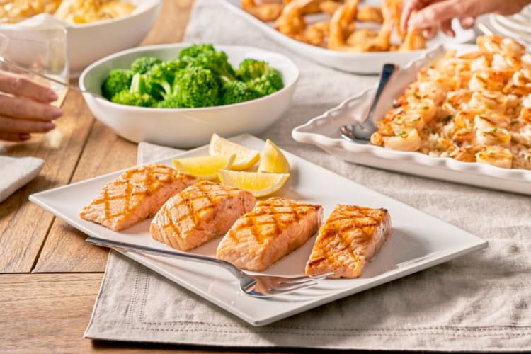 Salmon, broccoli and shrimp from Red Lobster on a table