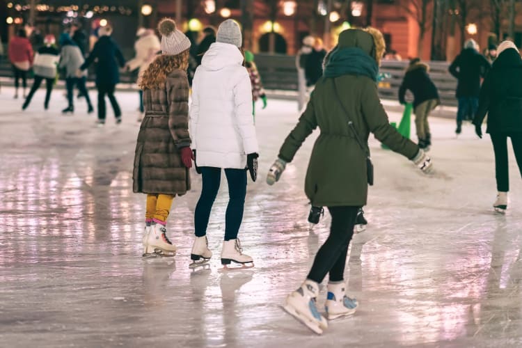People skating at an ice skating rink