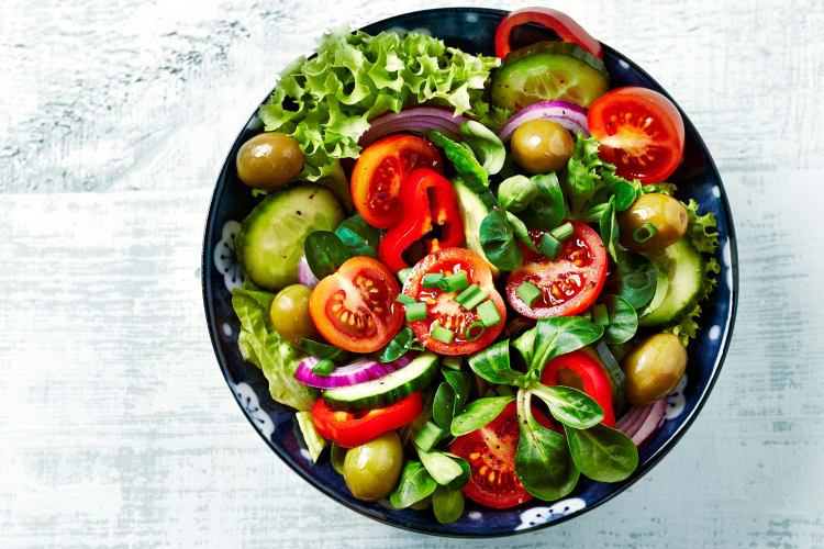 a bowl of summer vegetables