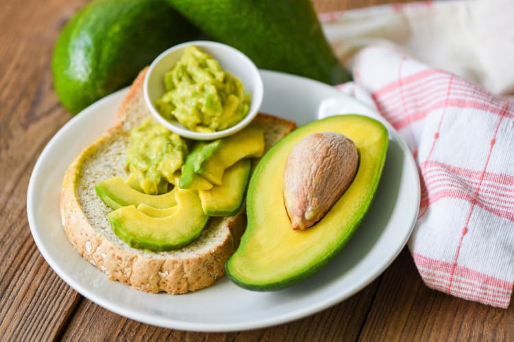 a plate of avocados on toast