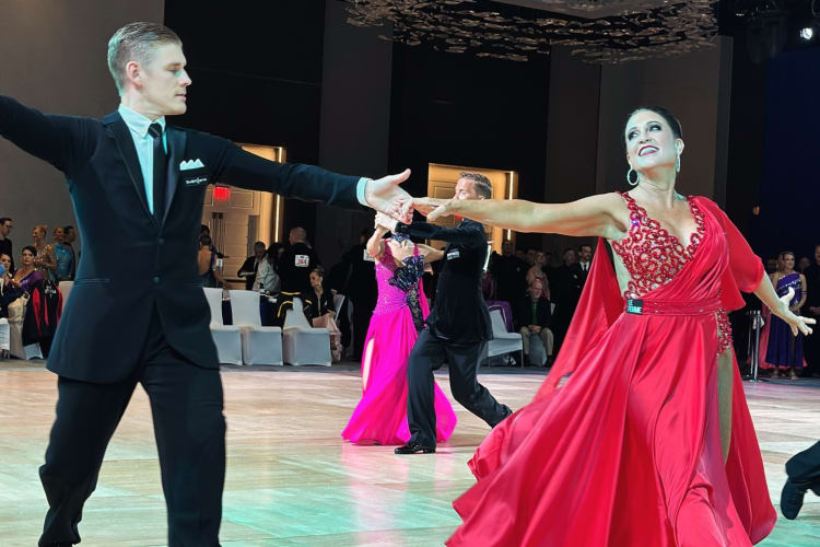 couples practicing ballroom dancing