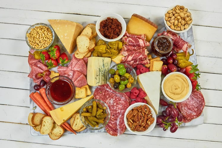 Aerial view of brettljause — an assortment of cold cuts of meat, cheeses, vegetables and fruit