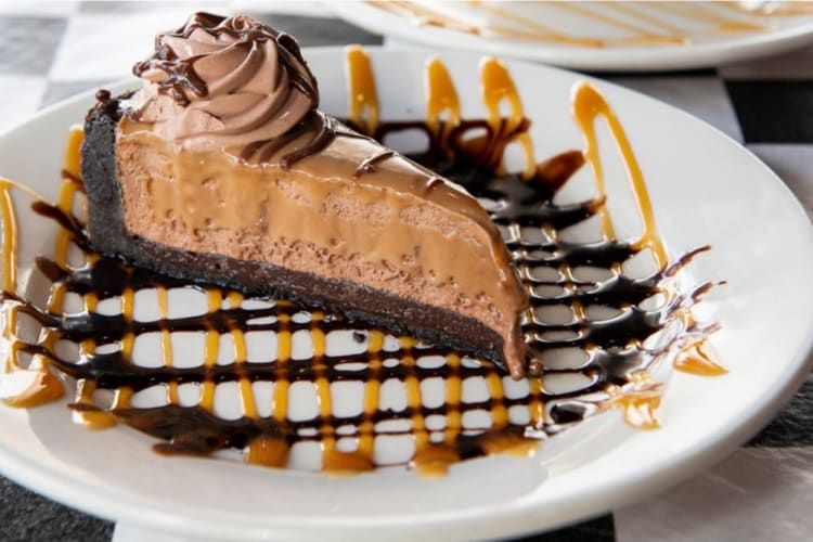 Chocolate caramel pie topped with chocolate cream