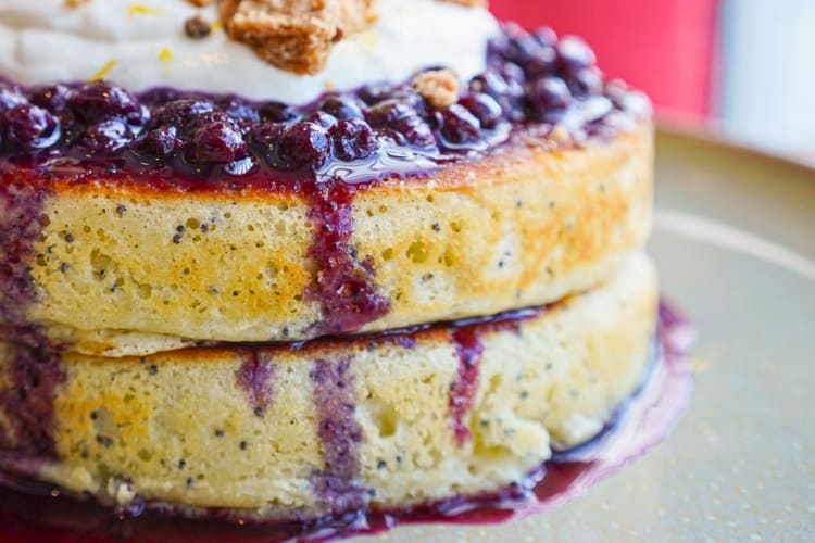 Try the house special, Juneberry pancakes: a plate of lemon poppyseed soufflé pancakes topped with whipped mascarpone, blueberry sauce and a crumb of pistachio shortbread. 