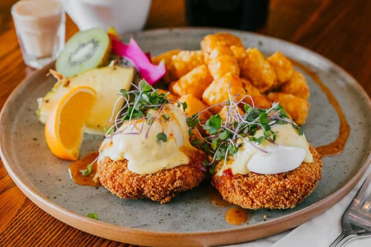 Lobster Benedict served with tater tots