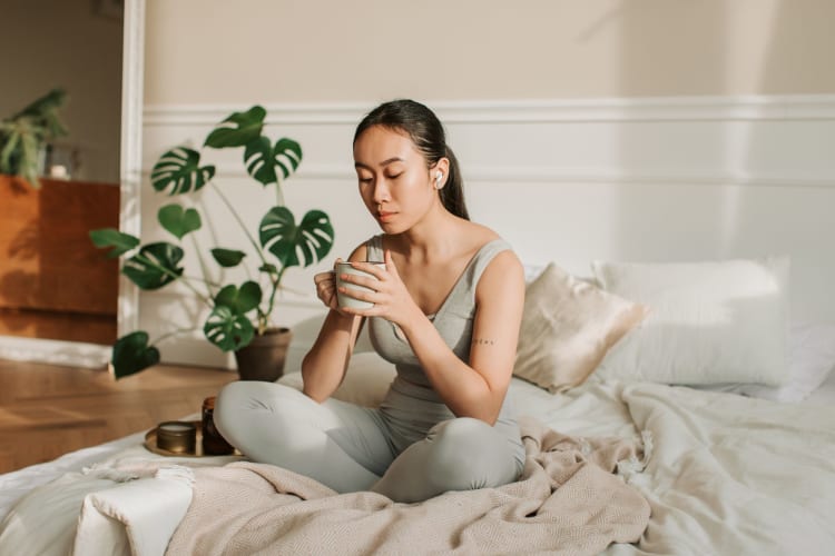 Woman drinking a cup of tea.