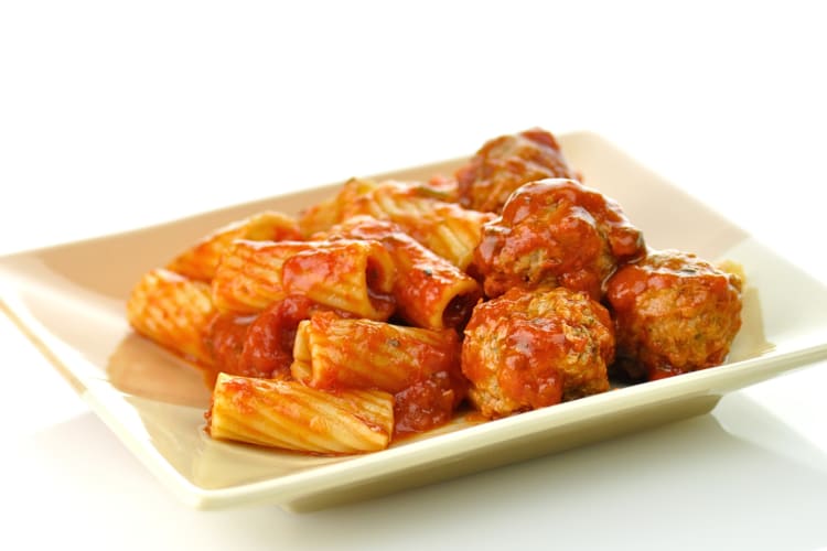 Meatballs and rigatoni on a white plate