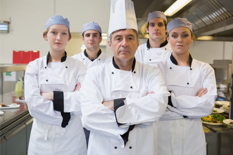 Five chefs at a kitchen