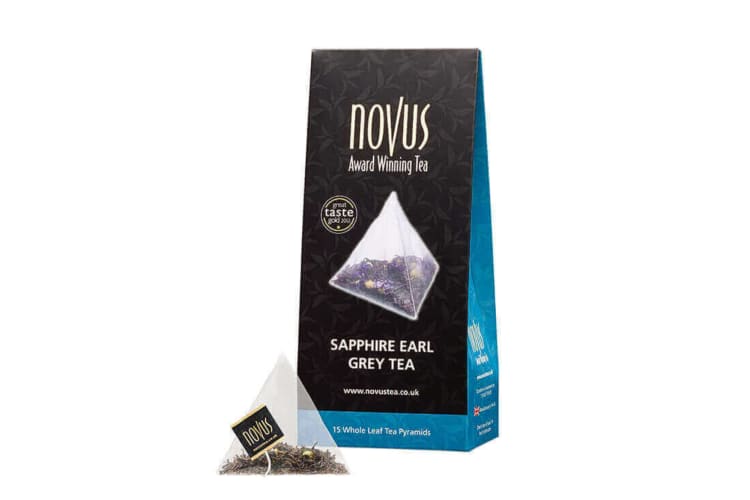 A box and teabag of Novus Earl Grey tea