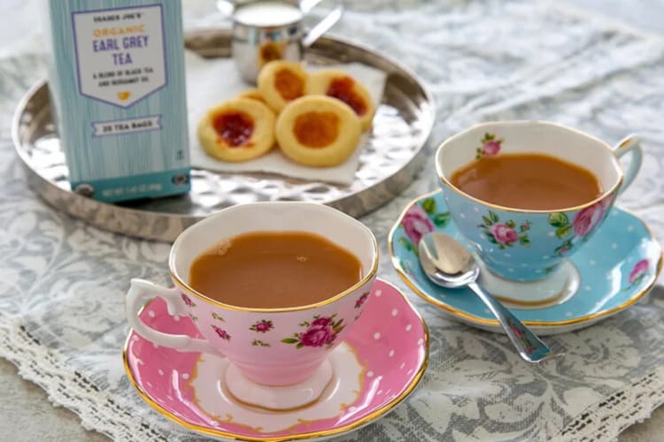 Cookies behind two cups of Trader Joe’s Earl Grey tea, one of the best Earl Grey teas