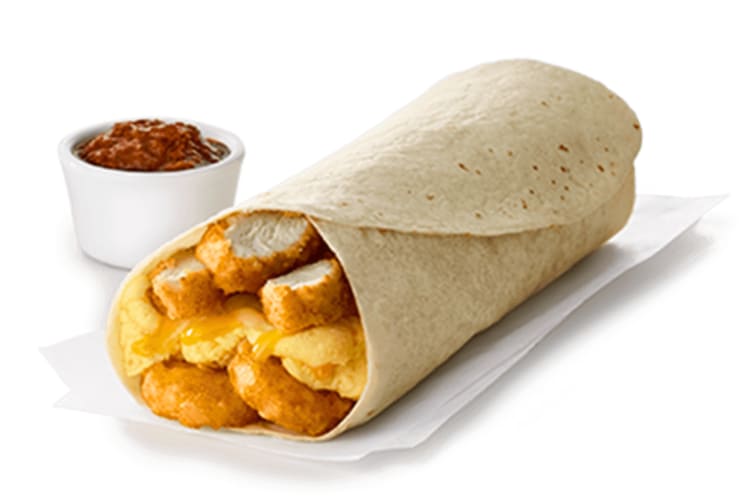 A Chick-fil-A breakfast burrito with eggs and chicken nuggets