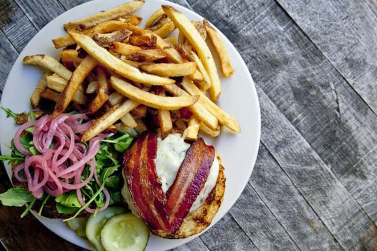A burger, fries and salad from a restaurant in Burlington, one of the best foodie cities in the world